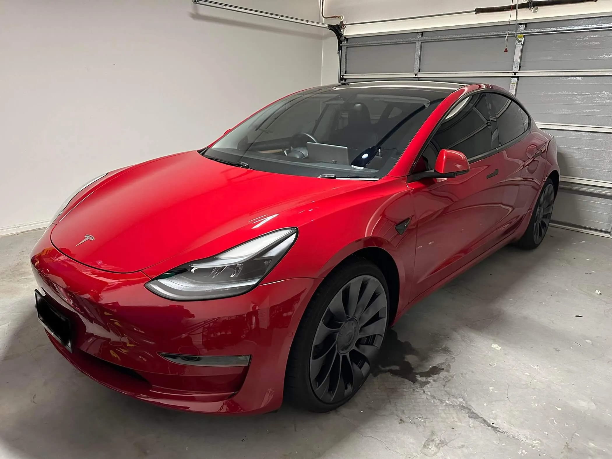 Red Tesla Model 3 ceramic-coated by R1 Auto